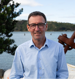 Karl Le Quesne wearning a blue shirt and glasses