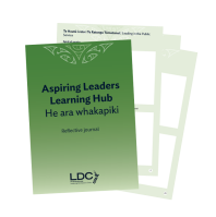 Aspiring Leaders Journal cover and a couple of inside pages fanned out